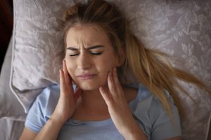 teeth grinding symptoms causes and treatments explained