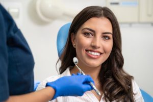 can a dental bridge be removed or replaced